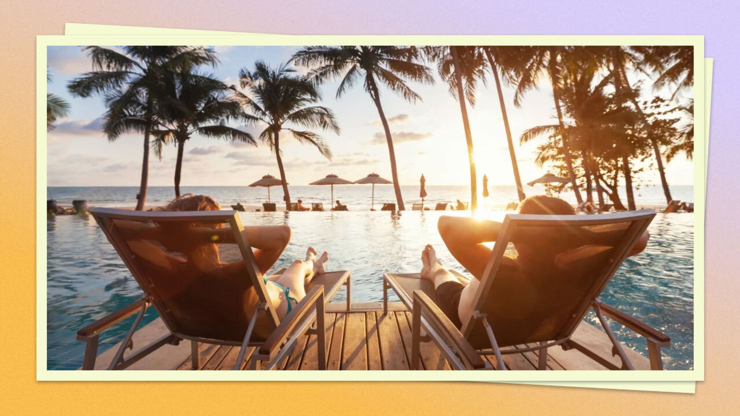 Beach chairs in front of pool and beach