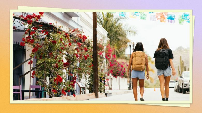 Two people walking in summer attire with backpacks