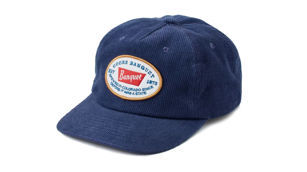A blue corduroy hat on a white background.