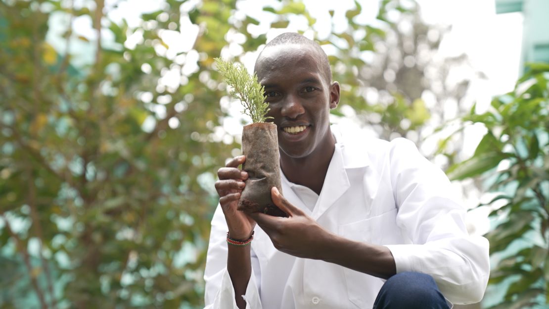 HyaPak Ecotech Limited founder Joseph Nguthiru with one of the company's seedling packets, created from water hyacinth sourced from Lake Naivasha.