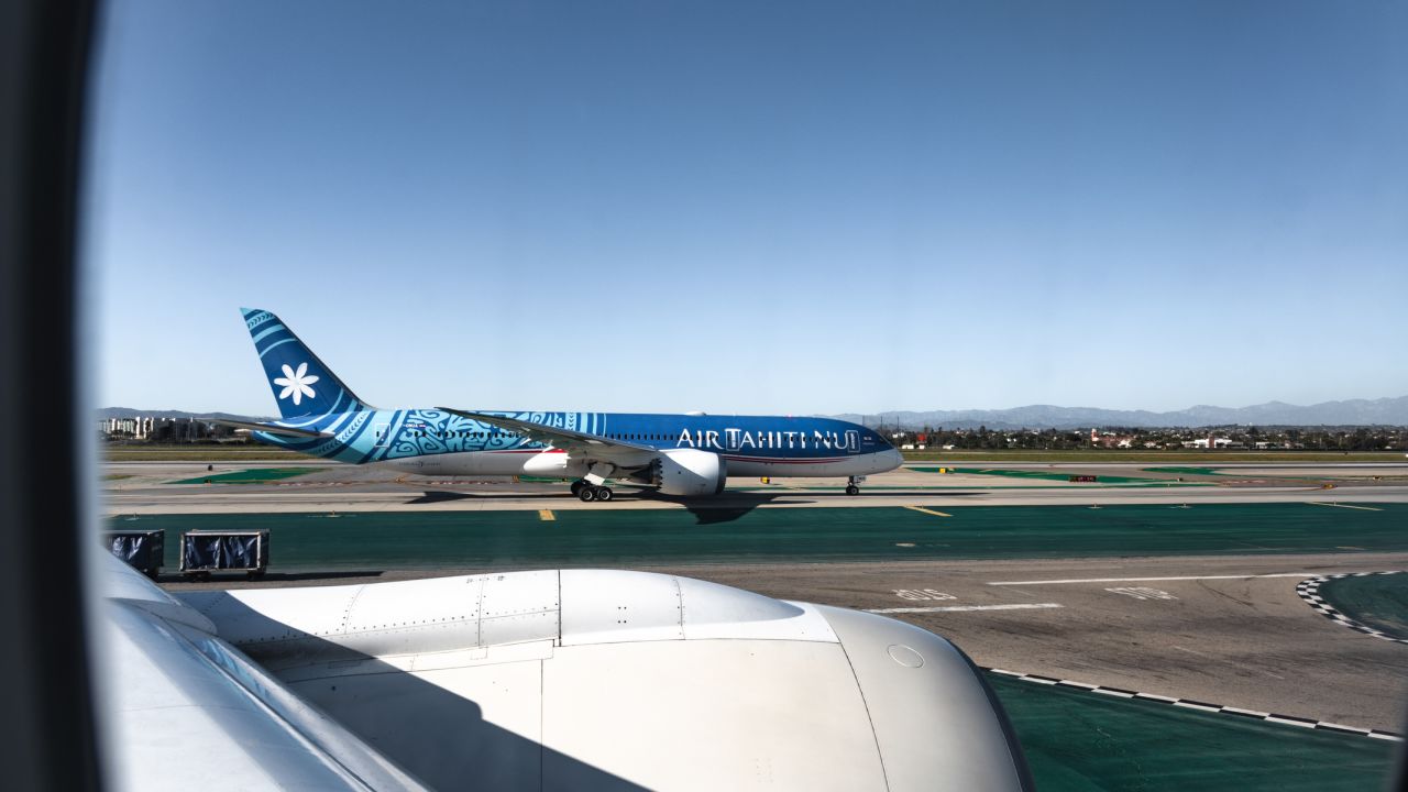 A side view of an Air Tahiti Nui Boeing 787-9 on the runway in Los Angeles International Airport (LAX).