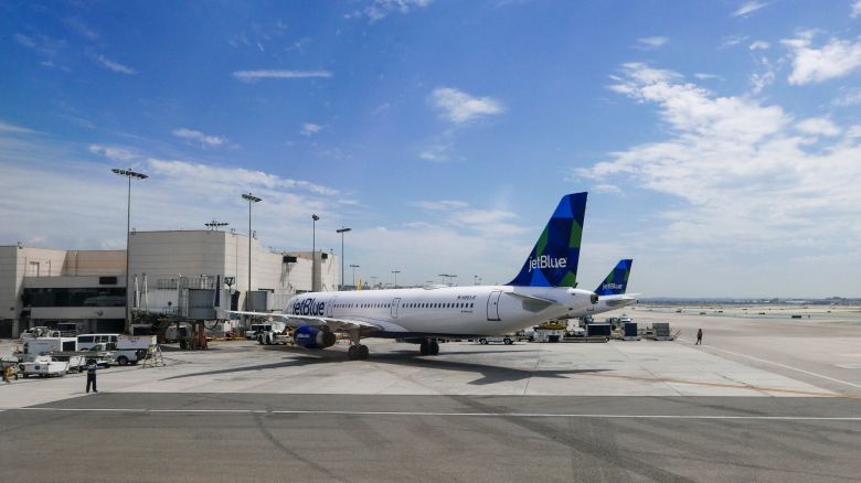A photo of two JetBlue Airbus aircraft parked at the gate in Los Angeles International Airport (LAX)