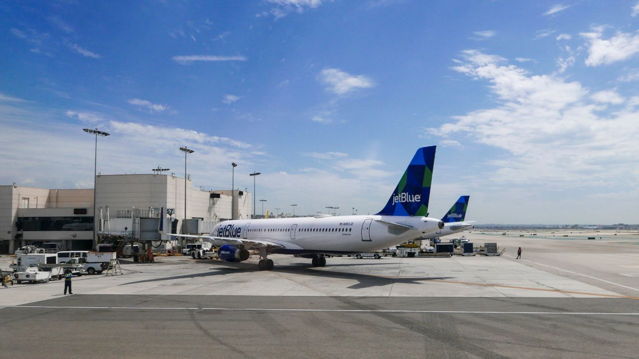 A photo of two JetBlue Airbus aircraft parked at the gate in Los Angeles International Airport (LAX)
