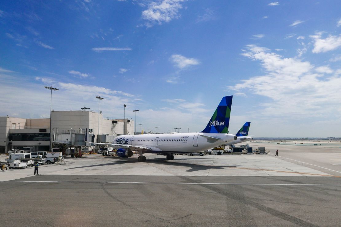 A photo of two JetBlue Airbus aircraft parked at the gate in Los Angeles International Airport (LAX)