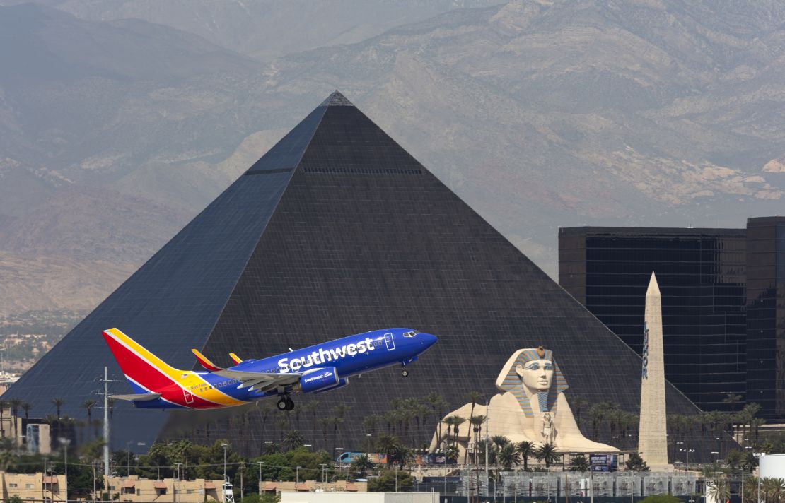 A photo of a Southwest Airlines Boeing 737 taking off in Las Vegas with the Luxor hotel in the background