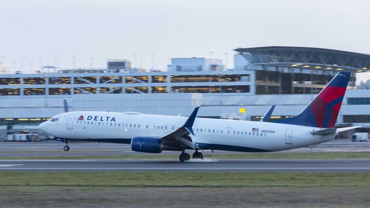 A photo of a Delta Airlines Boeing 737 landing at Portland International Airport.