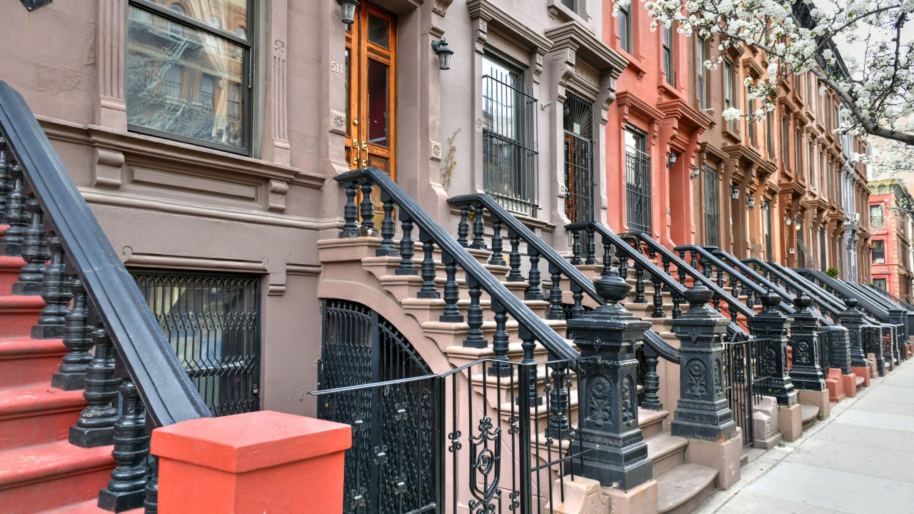 Residential brownstone buildings in Harlem, New York City.