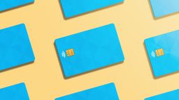 A pattern of blue credit cards over an orange background