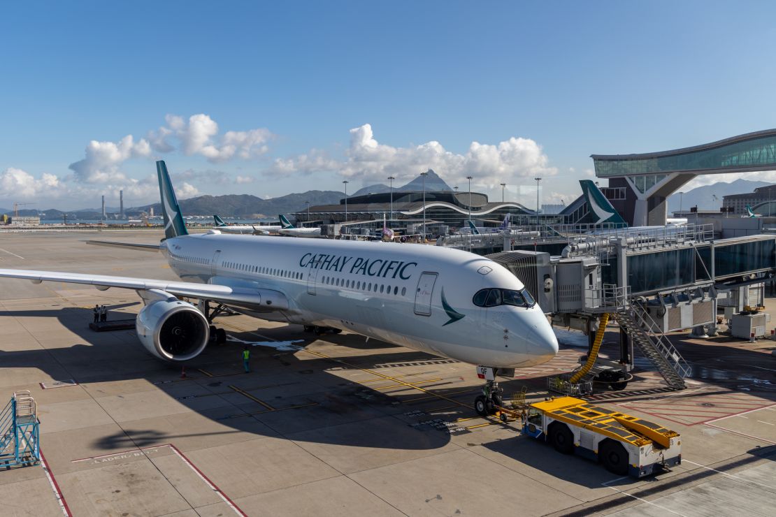 A photo of a Cathay Pacific Airbus A350 aircraft at the gate in Hong Kong International Airport