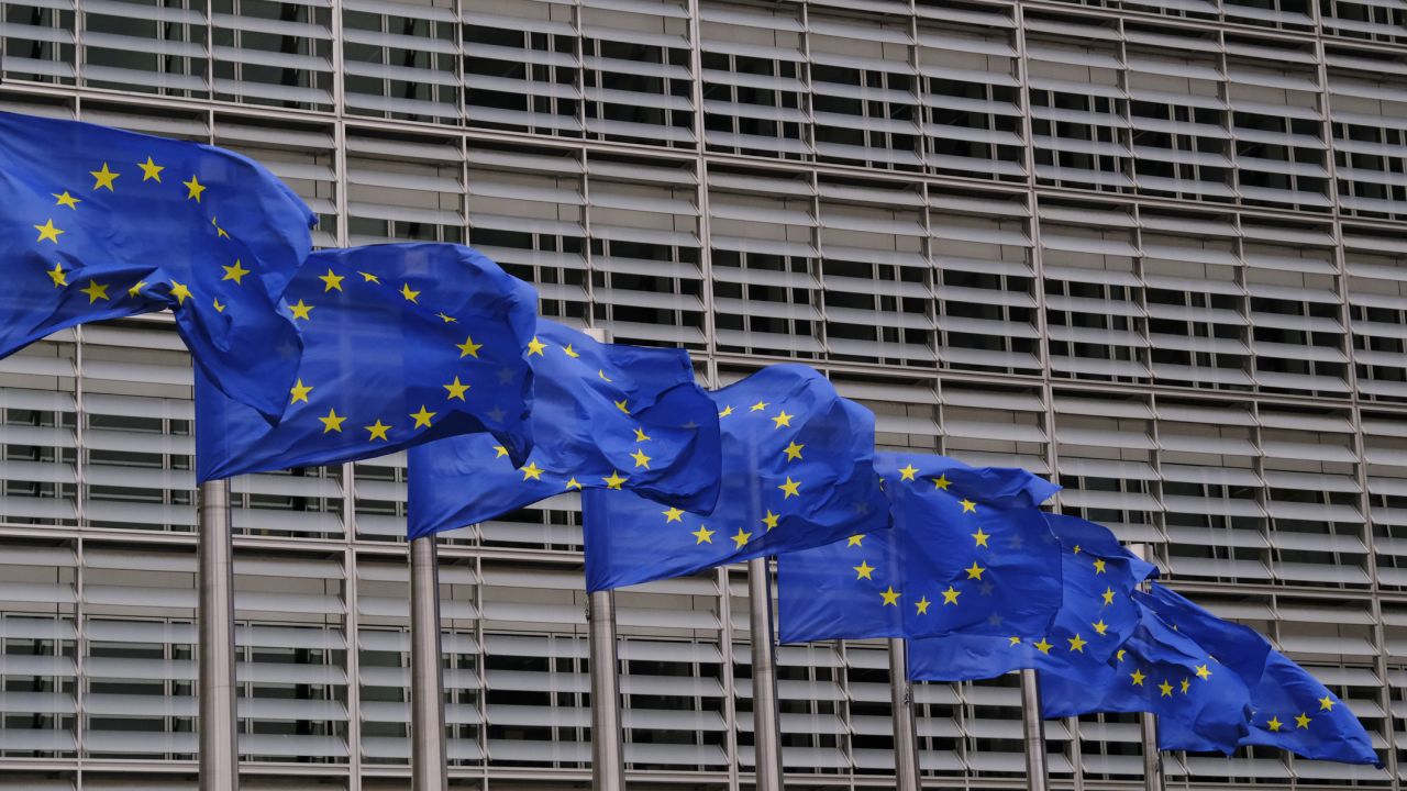 A photo of European Union flags outside of the EU headquarters in Brussels, Belgium