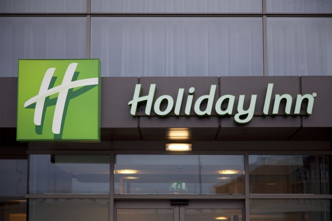 A photo of a Holiday Inn sign on the exterior of a hotel in Salford, United Kingdom