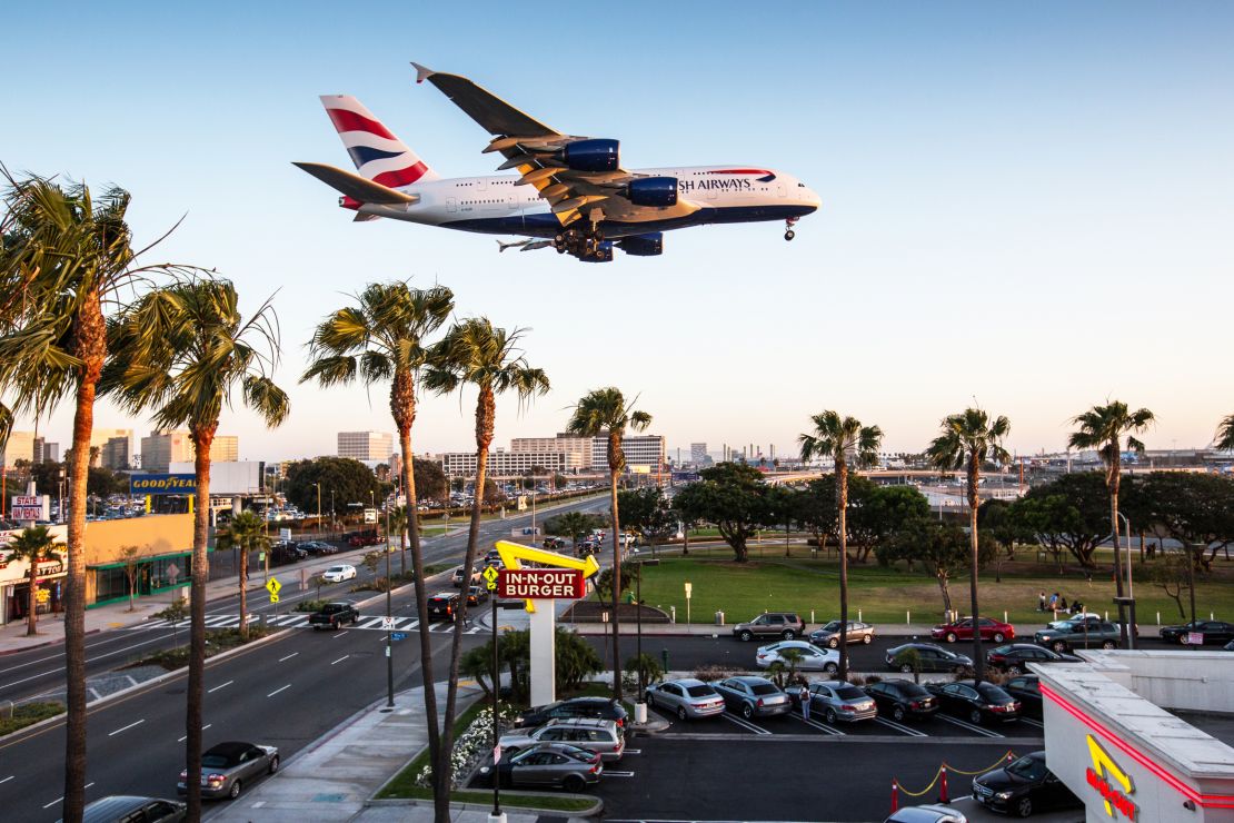 A photo of a British Airways A380 flying over an Inn-N-Out burger near Los Angeles International Airport