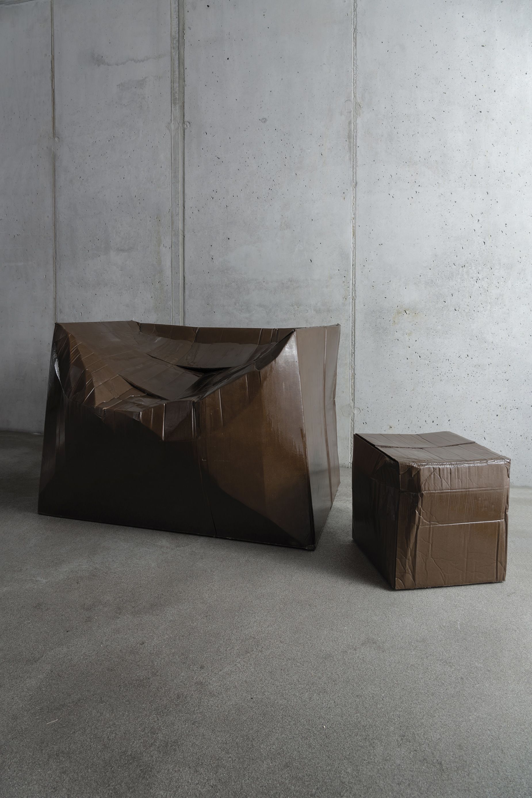 Ilya Goldman Gubin strengthens warped cardboard boxes with resin and fiberglass.
