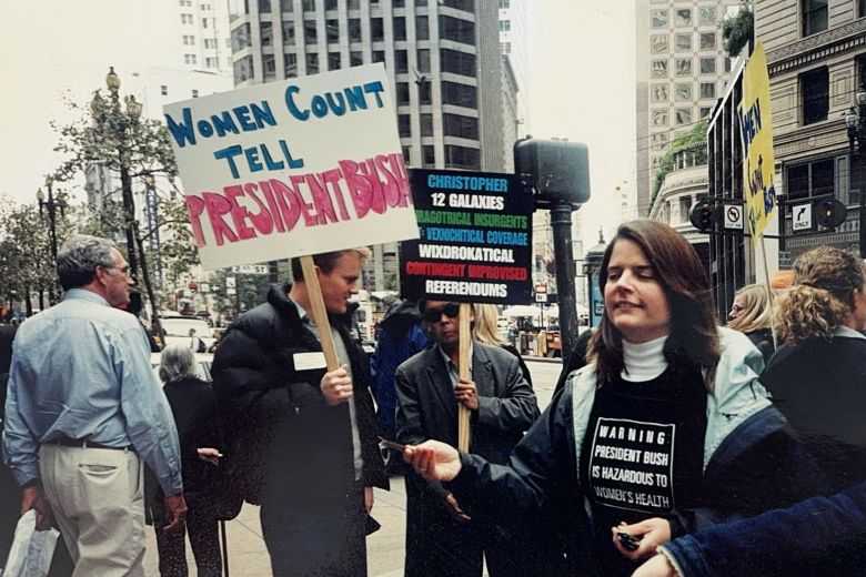 Jake Scott is seen holding a sign at a women’s rights march in San Francisco in 2004. Scott worked at Planned Parenthood at the time.