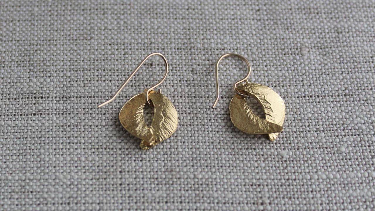 Small gold earrings by linguaNigra.