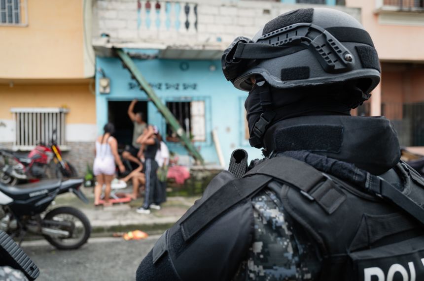 Police raid a suspected gangland neighborhood in Guayaquil.