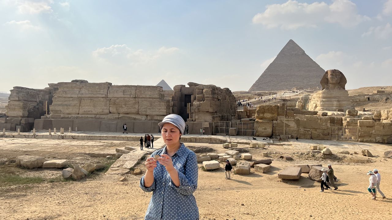 Eman Ghoneim studies the surface topography of the section of the ancient Ahramat Branch located in front of the Pyramids of Giza and the Great Sphinx. 
