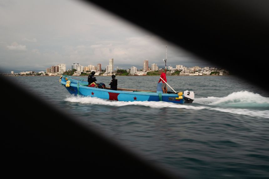 Suspected fuel/drug runner is apprehended by the Navy and brought back to shore in Manta.