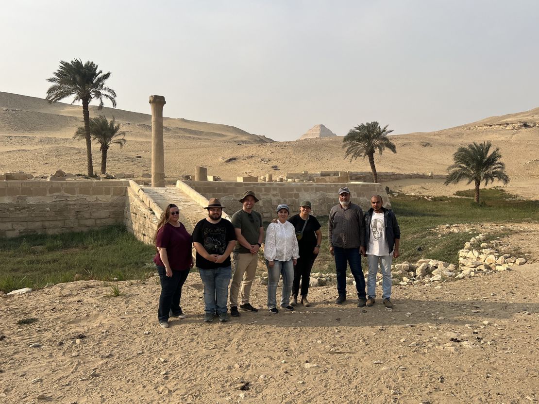 The research team stands in front of the Unas’s Valley Temple, which would have acted as a river harbor in ancient Egypt.
