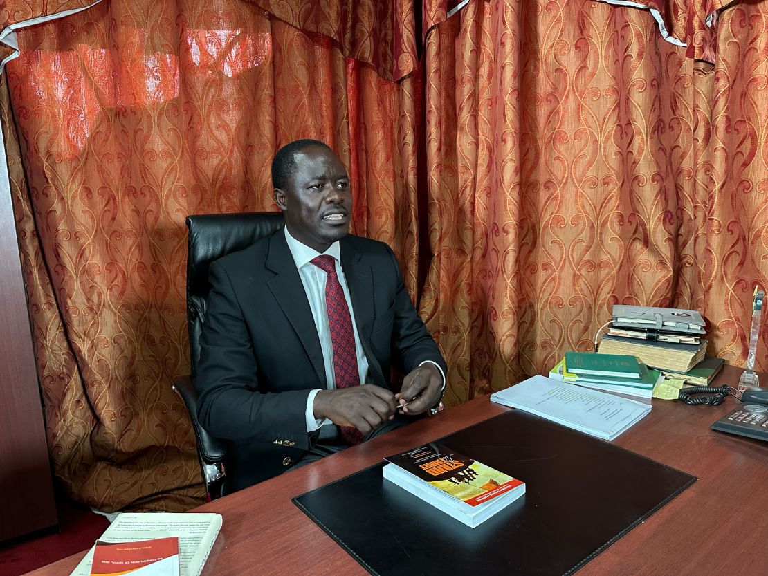 Kenyan opposition politician Peter Kaluma, the main sponsor of Kenya's Family Protection Bill 2023, shows a copy of Sharon Slater's book, "Stand For The Family," in his office in Nairobi.