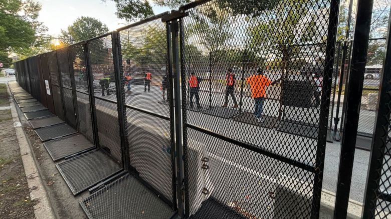 Chicago workers set up the additional line of security fences outside the United Center on Tuesday morning.