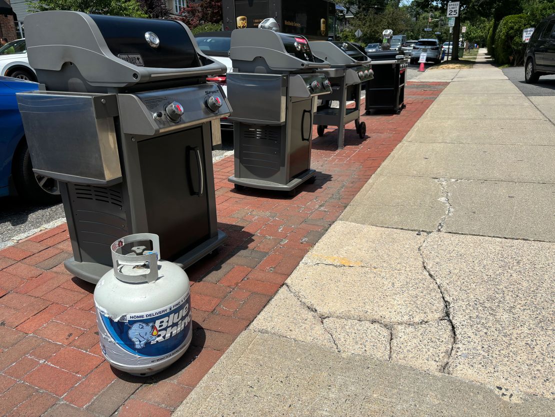 American Royal Hardware in Montclair, NJ, staff say they place barbecue grills on the sidewalk outside their store as a way to market the grills to motorists and pedestrians passing by at a busy town center.