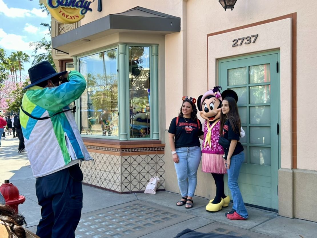 People take photos at Disney California Adventure Park on April 15.