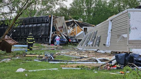 People survey the damage at a Michigan mobile home park on Tuesday.