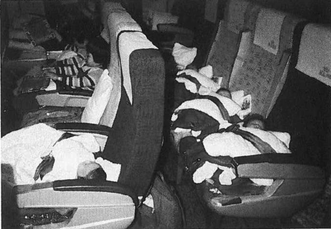 A photo from the commission’s report in March shows Korean babies strapped in airplane seats during their journey to Denmark in 1984.
