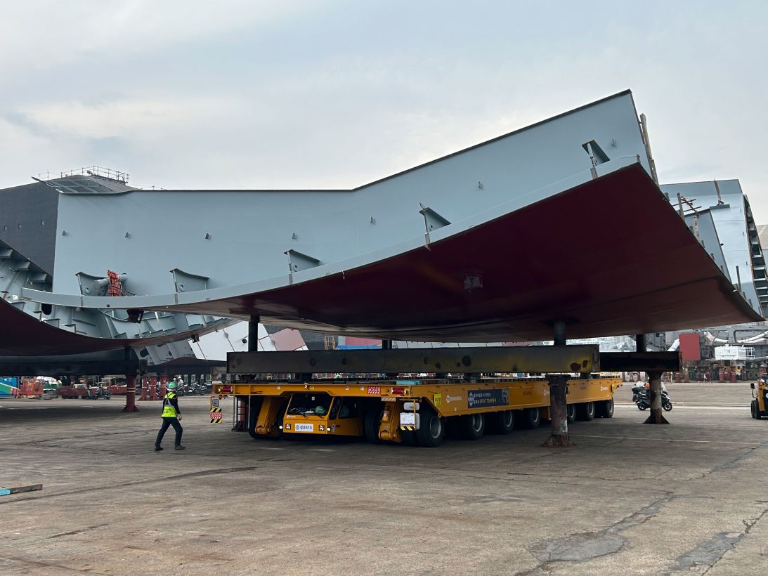 A section of ship hull is placed on four stanchions during the assembly process at HD Hyundai Heavy Industries shipyard in Ulsan, South Korea.