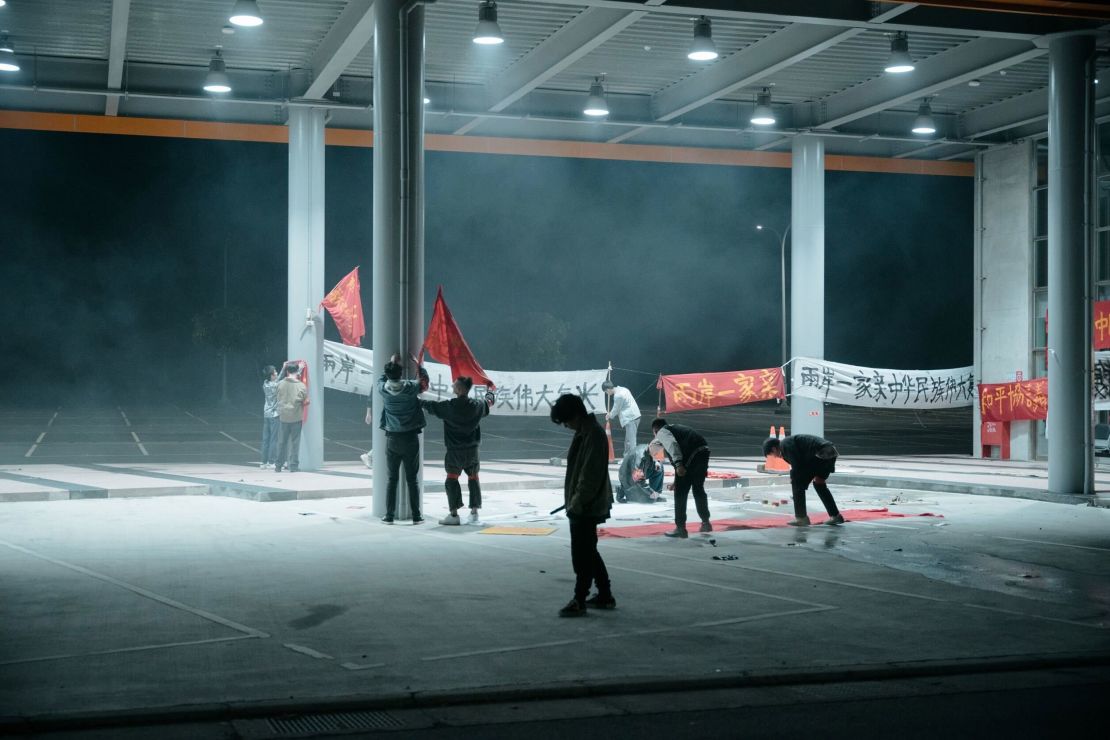 A scene from the trailer of "Zero Day" shows pro-Beijing supporters hanging up banners calling for unification.