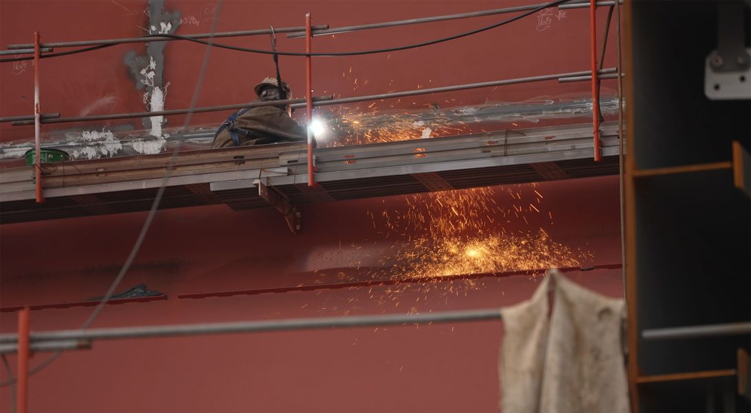 A worker welds on a ship at HD Hyundai Heavy Industries in Ulsan, South Korea.