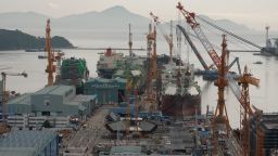 The Hanwha Ocean shipyard in Geoje, South Korea. The US Navy supply ship USNS Charles Drew undergoes maintenance at middle left.