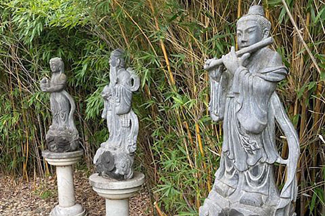 Statues of Chinese deities are damaged at the Yi Yuan Chinese Garden.