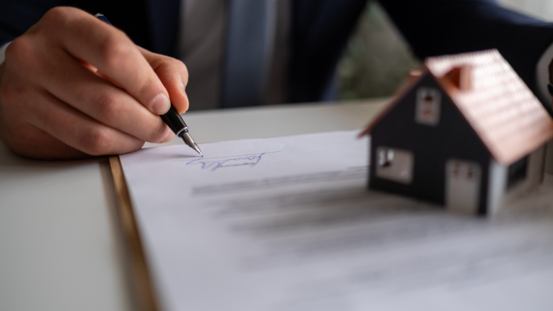 Man signs a legal contract.