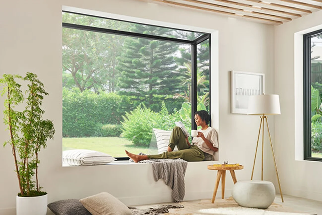 Homeowner sits in Marvin Skycove window