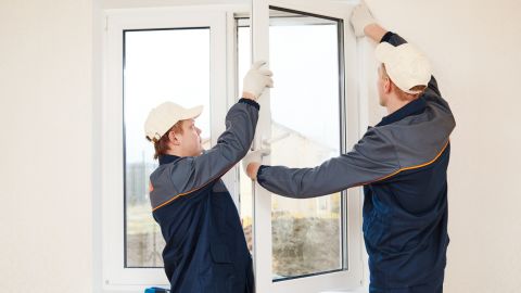 Window installers adjusted a window panel