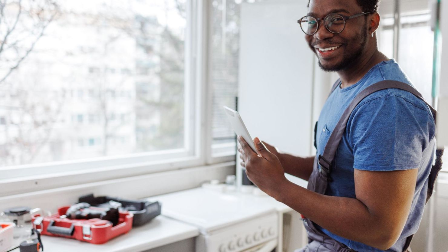 Service technician fixing a broken oven.