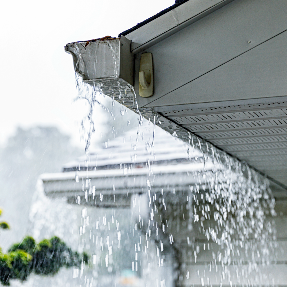 Aluminum K-style roof gutters on a suburban Colonial-style house near Rochester, New York.