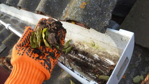 Cleaning dirty, clogged gutters that don’t have a gutter guard