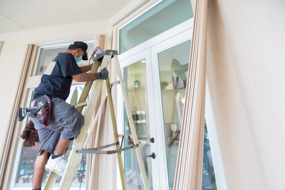 Contractor installs hurricane shutters