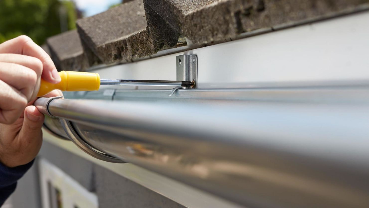 Installing a new gutter guard on a home