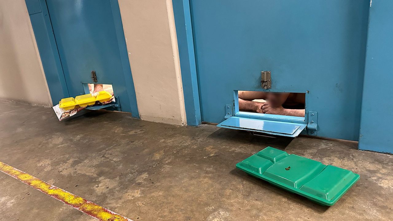 Food is delivered to prisoners in their cells through a small hatch.