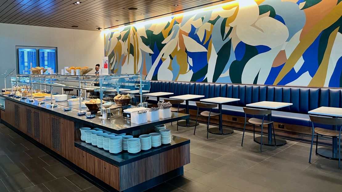 A photo of a buffet and seating at the Atlanta Centurion Lounge