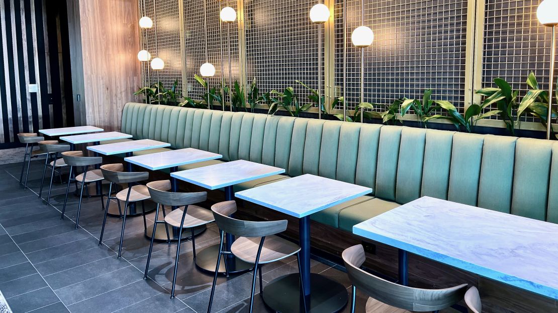 A photo of booth-style seating in the Atlanta Centurion Lounge