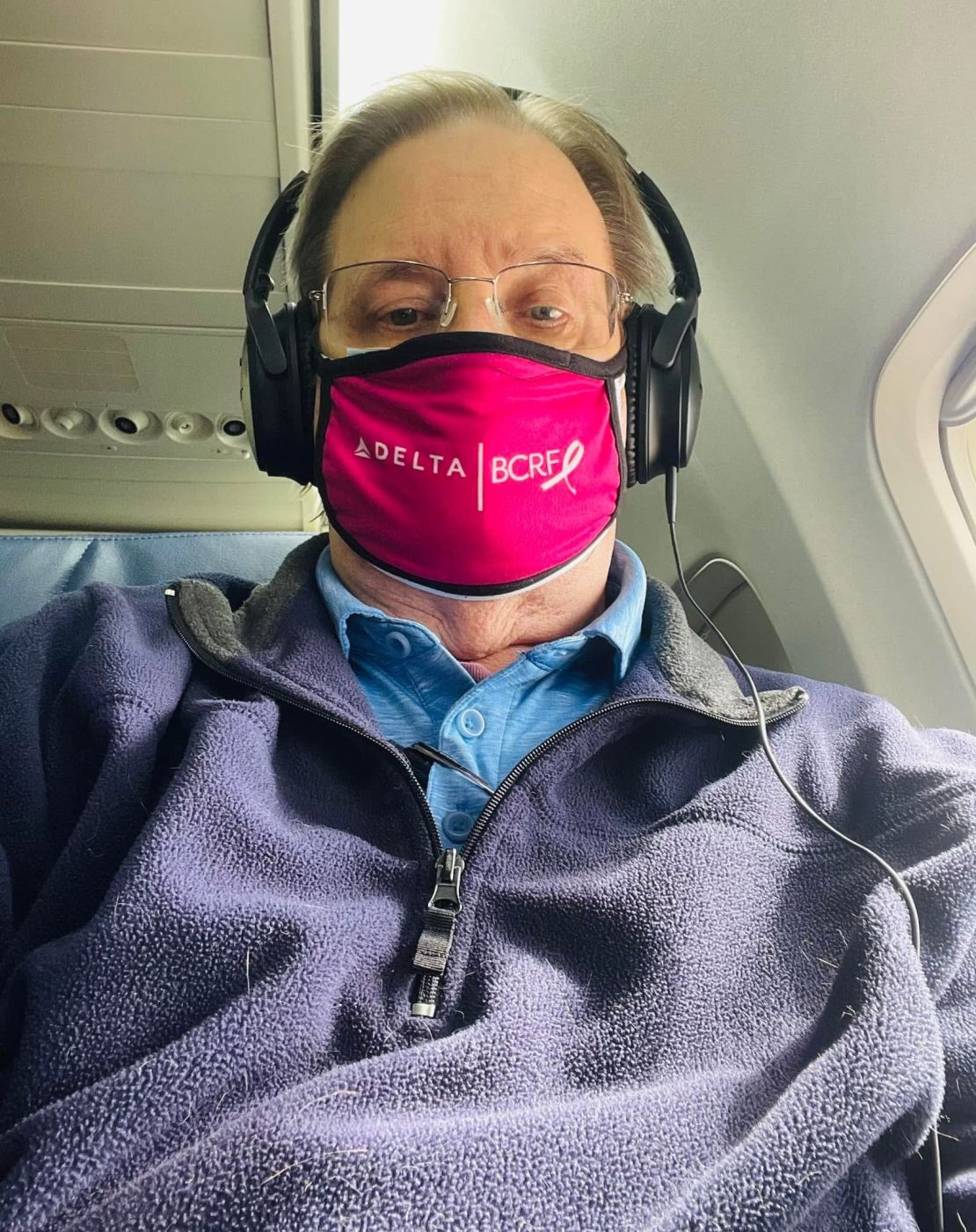 Bruce Gamble traveling on one of his many flights for work. He calls himself “semi-retired,” as he still does some training at car dealerships.