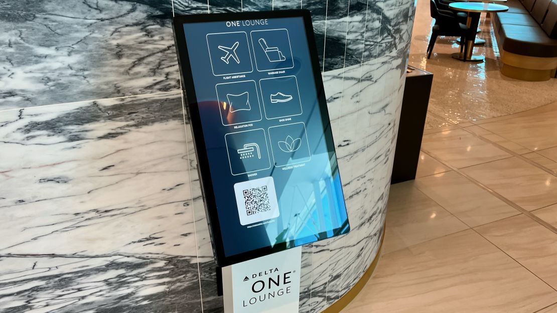 A photo of a reservation kiosk at the Delta One Lounge