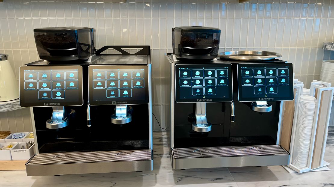 A photo of two espresso machines in the Delta One Lounge