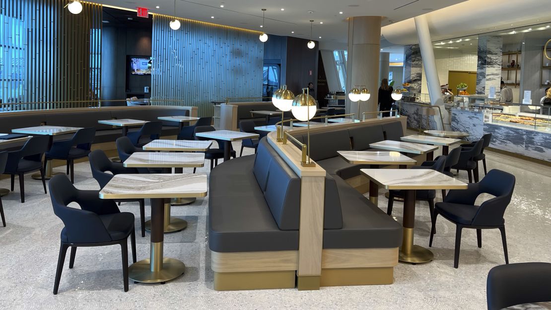 A photo of seating in the market dining area in the Delta One Lounge