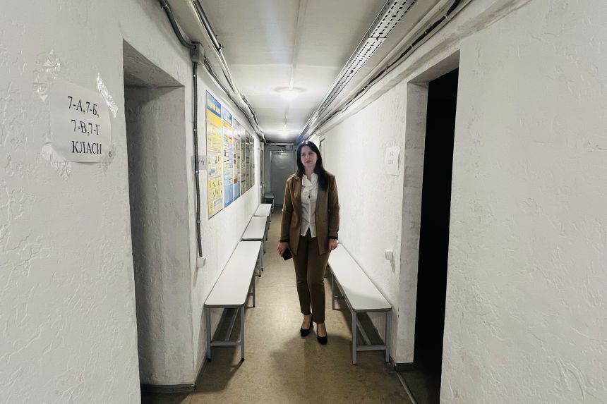 Liudmyla Andruk, deputy principal of Kyiv Gymnasium of Oriental Languages 1, stands in the school's shelter.